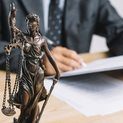 close-up-themis-lady-justice-holding-scale-front-lawyer-working-