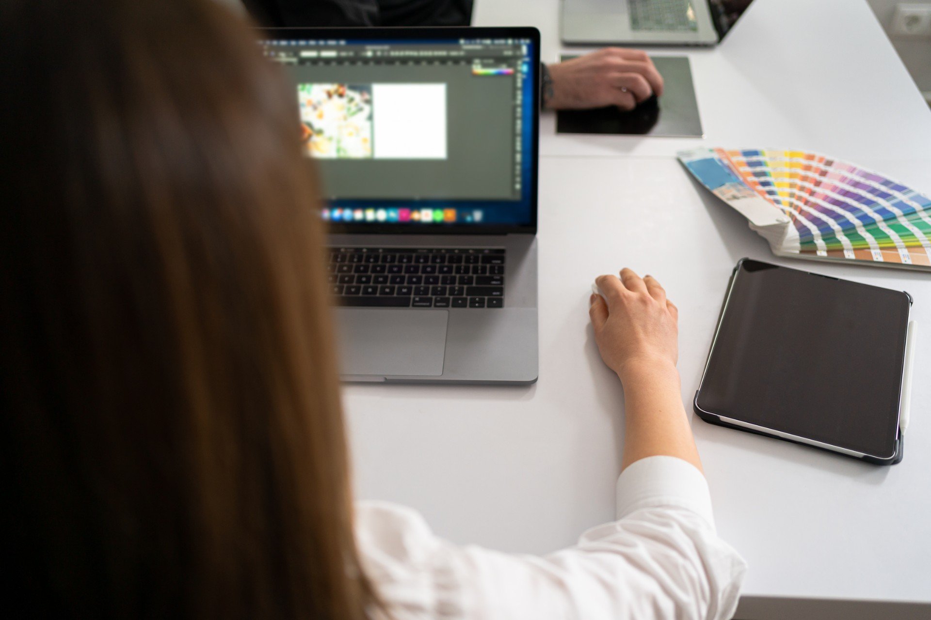 portrait-of-young-man-sitting-at-his-desk-in-the-o-202