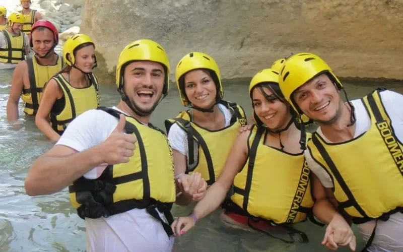 Friends in yellow helmets in the river – Belek Rafting Prices & Tours