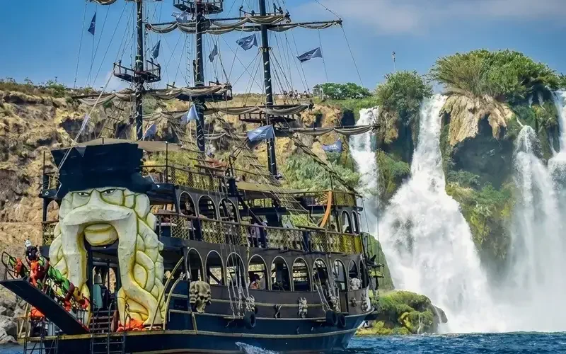 Pirate ship boat tour sailing past the Lower Düden Waterfall in Antalya