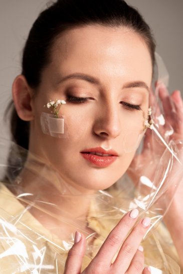 woman-with-band-aid-flower-pplastic-face