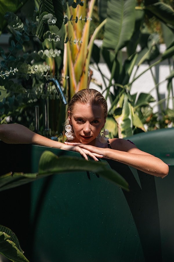 Woman enjoying a bath at Q Spa & Wellness